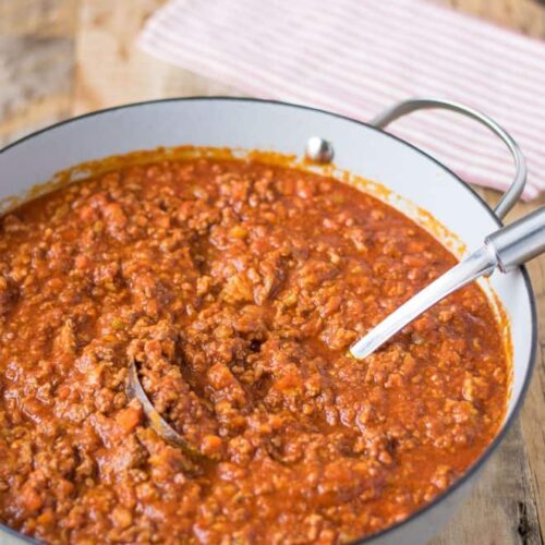 Traditional Bolognese sauce simmering with tomatoes and wine