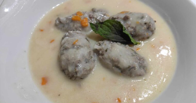 Giouvarlakia Greek Meatball Soup is made with beef.pork in a egg lemon sauce