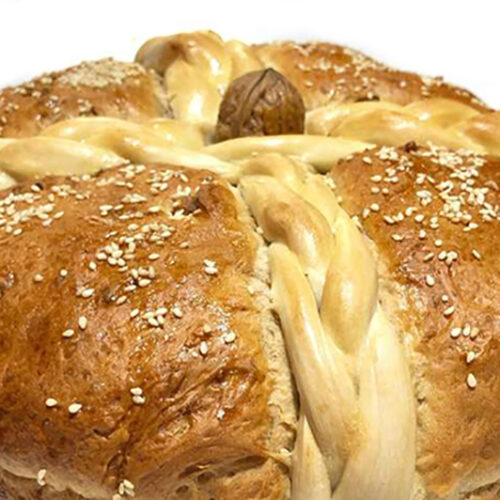 Christopsomo, cecorated with intricate Traditional Greek Christopsomo bread,