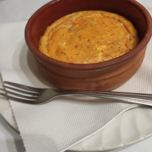 Strapatsada with tomato and feta cheese, oven baked