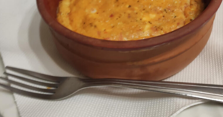 Strapatsada with tomato and feta cheese, oven baked