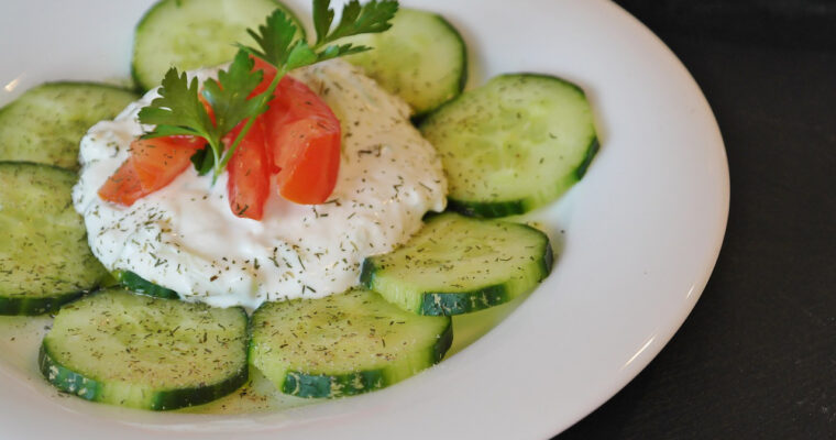 Traditional homemade tzatziki served in a bowl, made with Greek yogurt, cucumber, garlic, and olive oil.