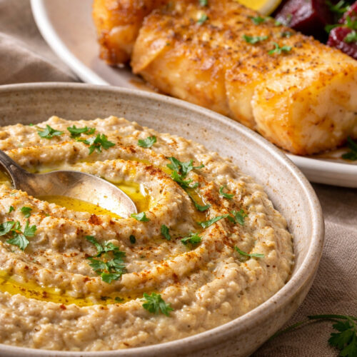 traditional skordalia with walnuts served with fried cod and beet salad